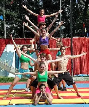 circusb – Long Lake Camp For The Arts Campers building a fun human pyramid during activities.