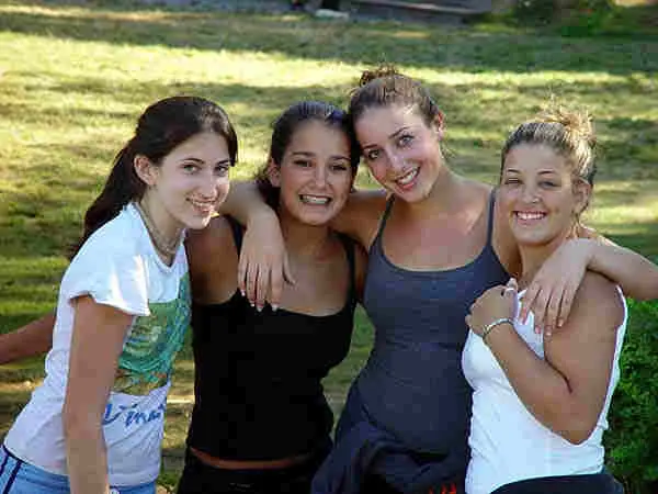 frei01 – Long Lake Camp For The Arts Four friends posing together during free time at camp.