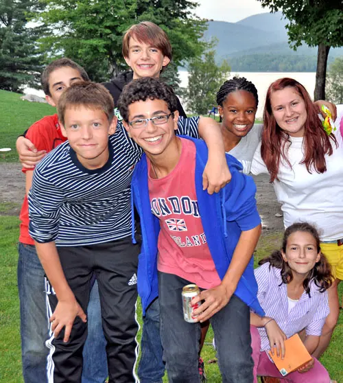 rechallfriends – Long Lake Camp For The Arts Group of campers smiling and posing together outdoors.