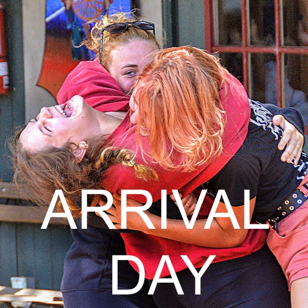 Campers hugging and reuniting on arrival day.