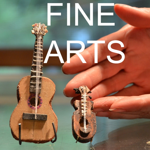 Miniature guitar crafts created in fine arts class at camp.