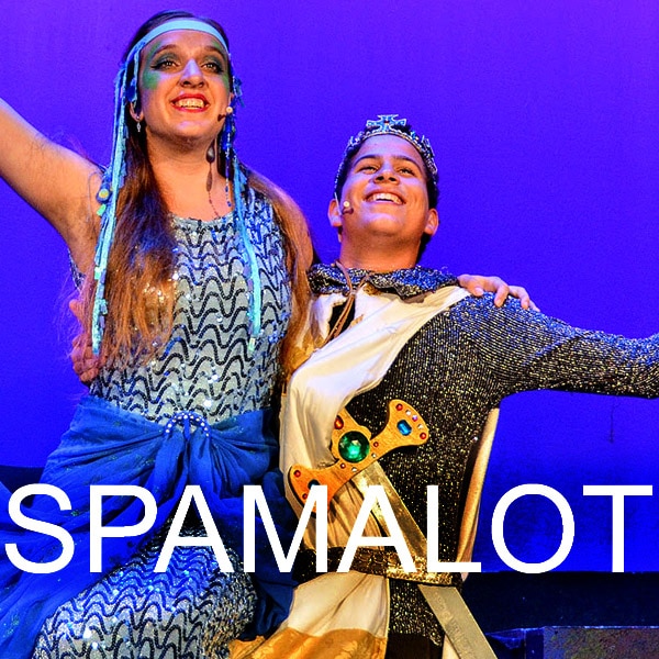 Actors in costume performing a comedy scene from Spamalot.