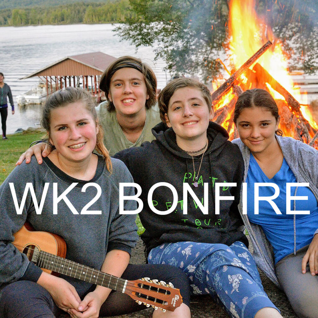 Evening bonfire celebration with group photos.