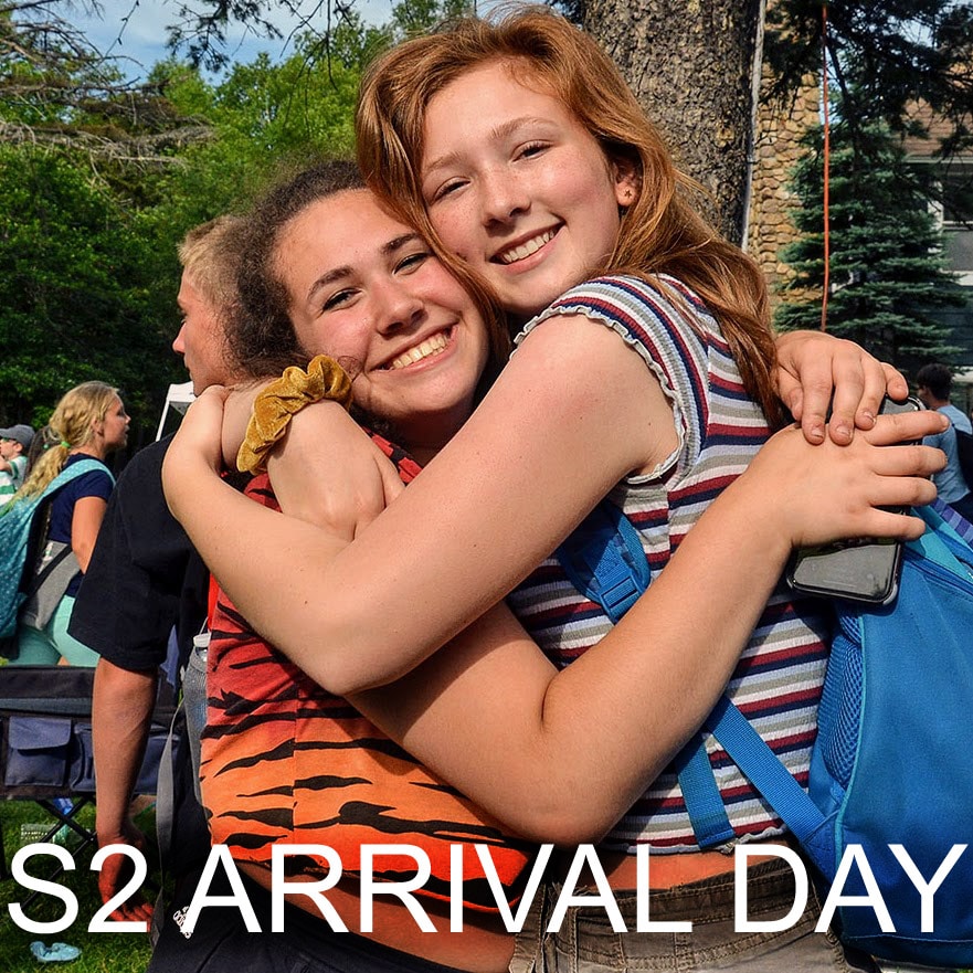 Campers arriving at Long Lake Camp as buses pull in