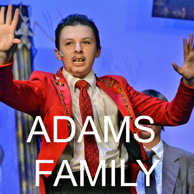 The Addams Family stage performance with young actors.