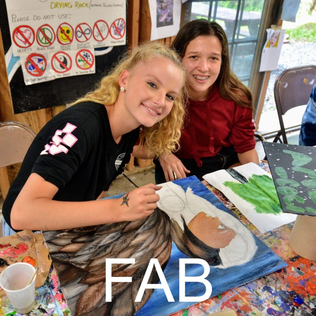 Campers creating artwork in the fine arts studio.