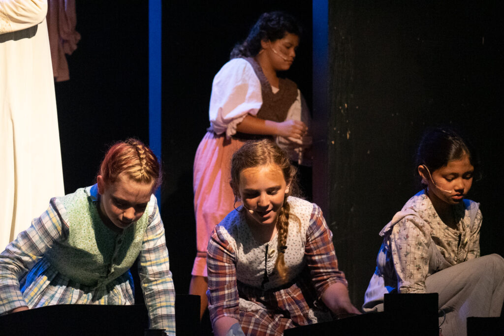 Long Lake Camp for the Arts campers portraying Annie roles