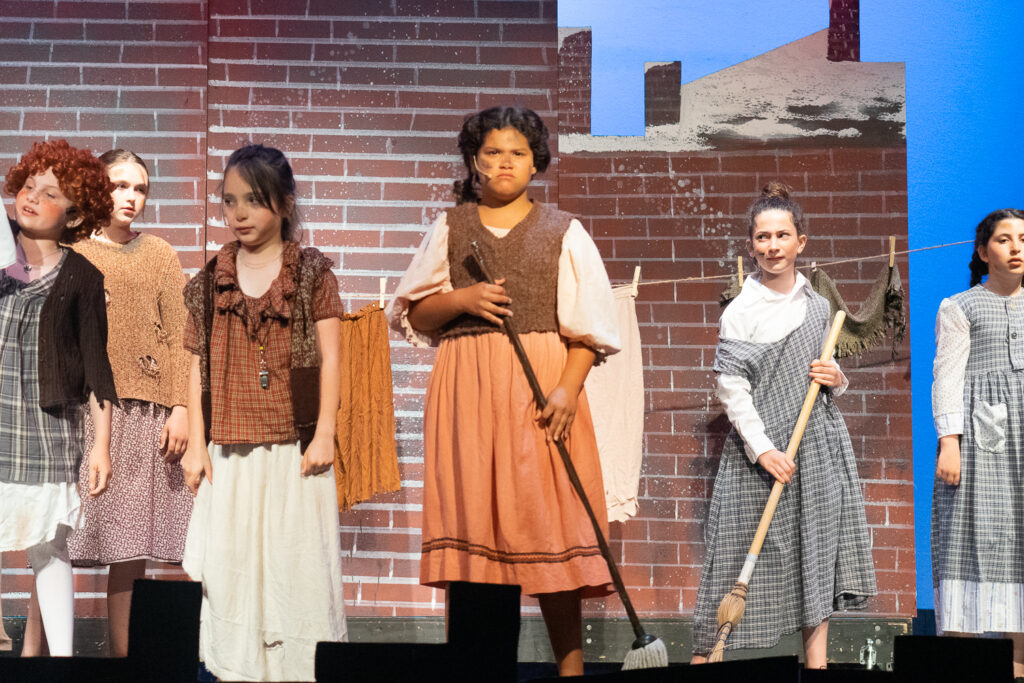 Long Lake Camp for the Arts kids reenacting Annie moments