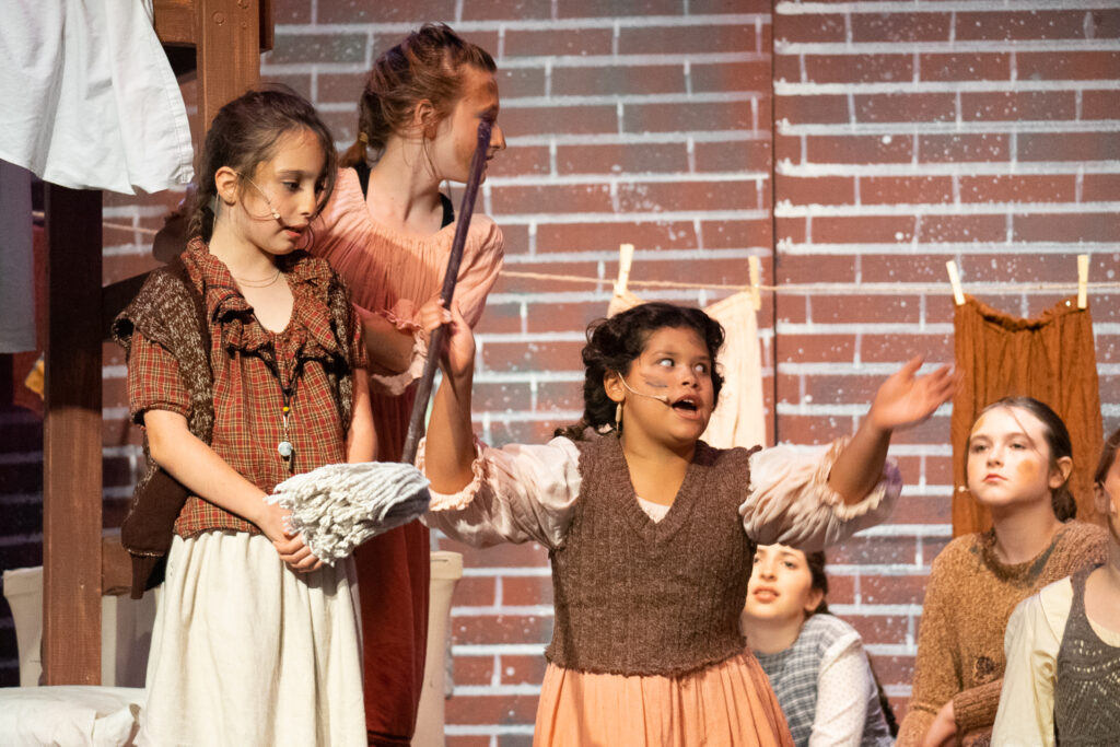 Long Lake Camp for the Arts kids reenacting Annie moments