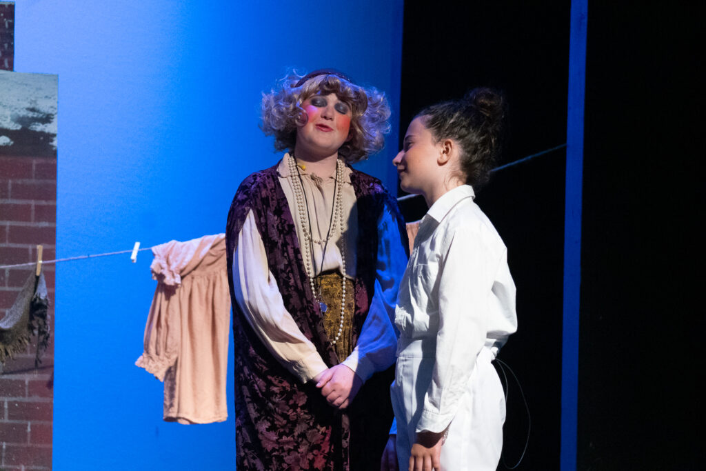 Annie actors on stage during Long Lake Camp for the Arts show