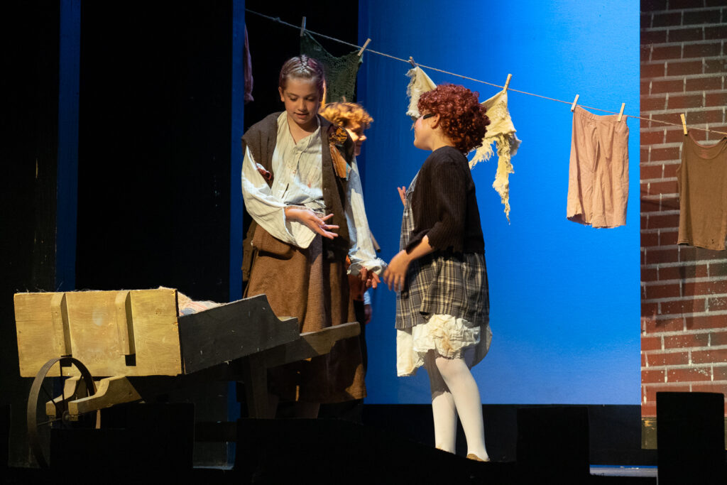 Campers presenting Annie musical at Long Lake Camp for the Arts