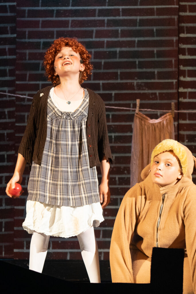 Long Lake Camp for the Arts drama campers portraying Annie characters