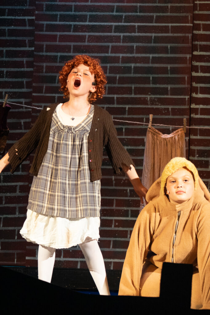 Annie stage scene by young actors at Long Lake Camp for the Arts