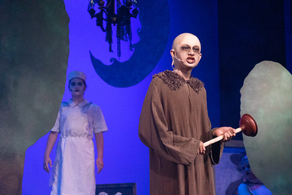 Long Lake Camp for the Arts actors in colorful Addams Family costumes