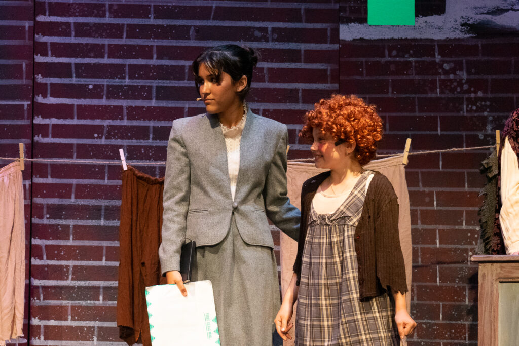 Annie characters on stage at Long Lake Camp for the Arts