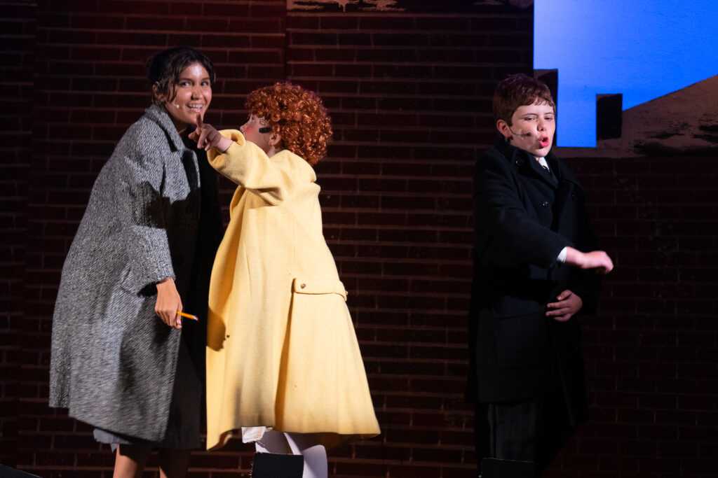 Annie cast members on stage at Long Lake Camp for the Arts
