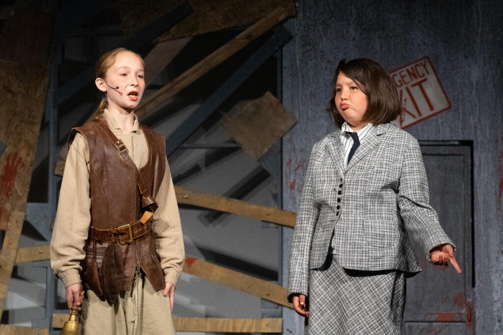 Zombie-themed youth stage performance at summer camp.