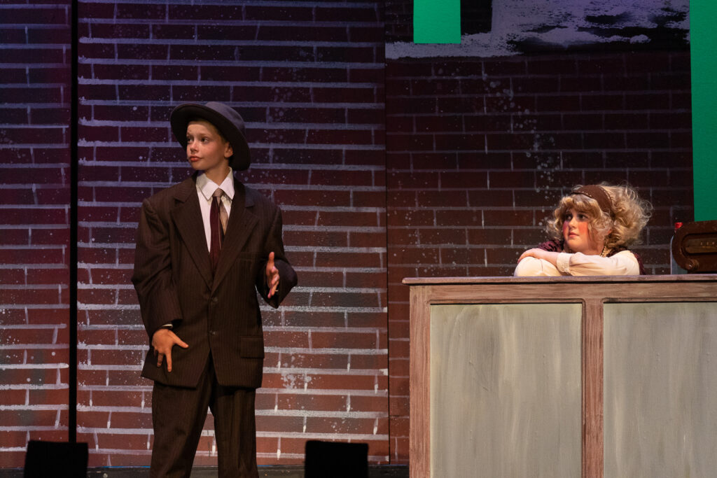 Campers acting in Annie at Long Lake Camp for the Arts