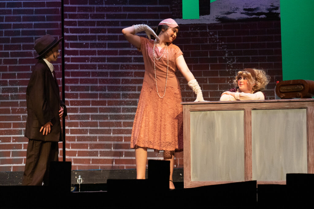 Campers acting in Annie at Long Lake Camp for the Arts