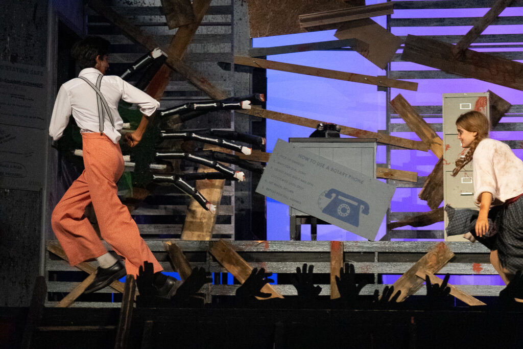 Zombie-themed youth stage performance at summer camp.