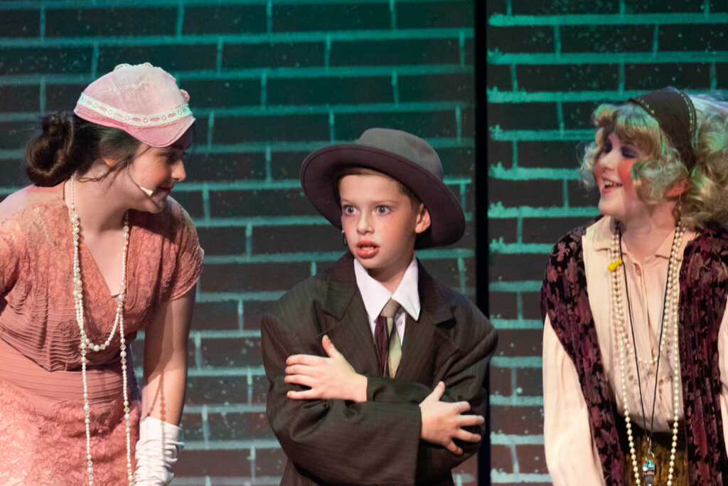 Campers acting in Annie at Long Lake Camp for the Arts