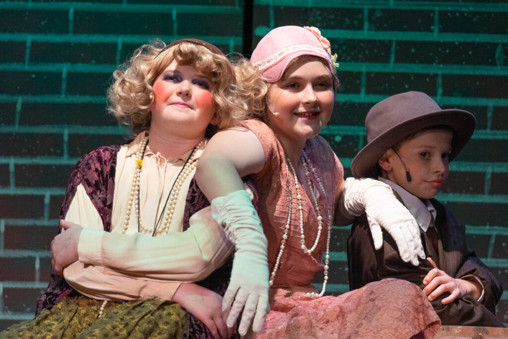 Long Lake Camp for the Arts youth performing an Annie scene
