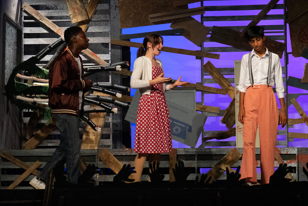 Zombie-themed youth stage performance at summer camp.