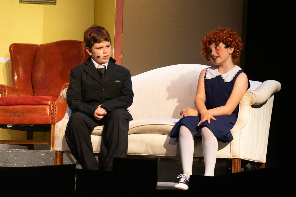 Long Lake Camp for the Arts youth performing an Annie scene