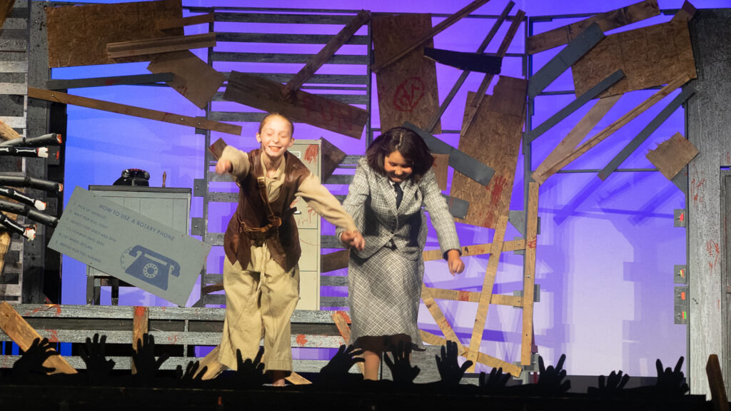 Zombie-themed youth stage performance at summer camp.
