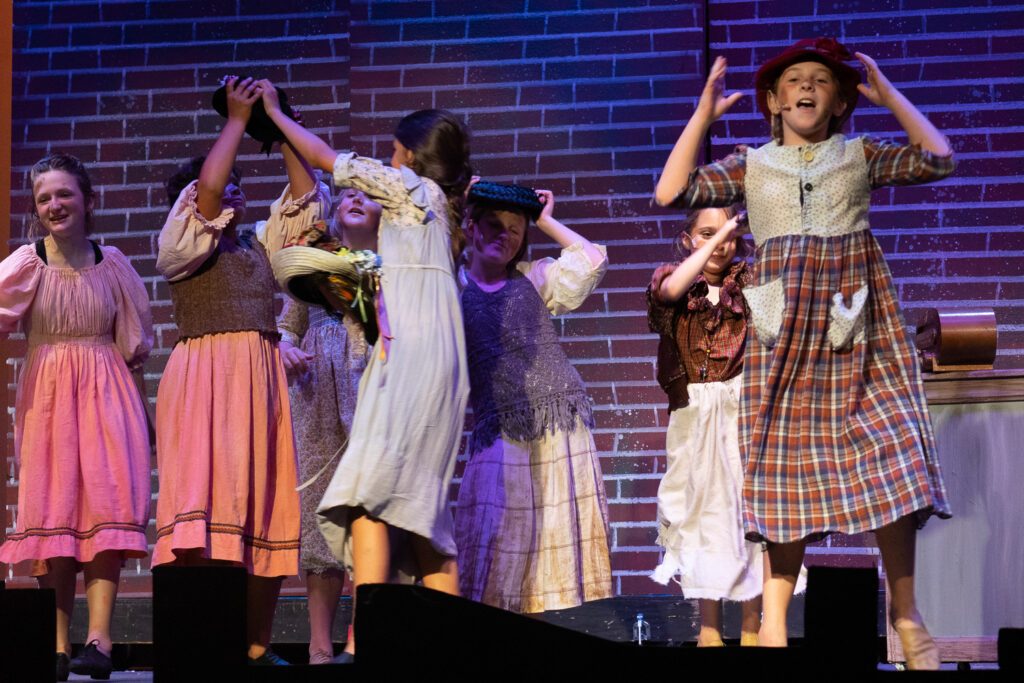 Annie cast performing live at Long Lake Camp for the Arts