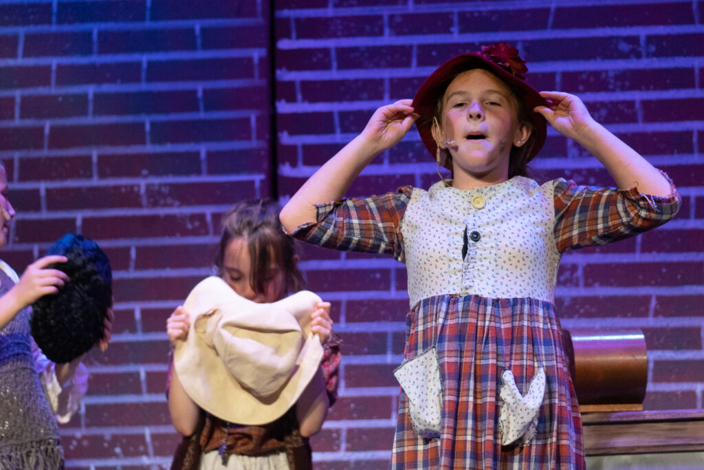 Long Lake Camp for the Arts children acting in Annie production