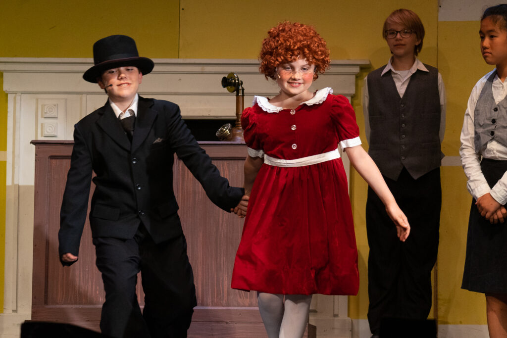 Long Lake Camp for the Arts youth performing an Annie scene