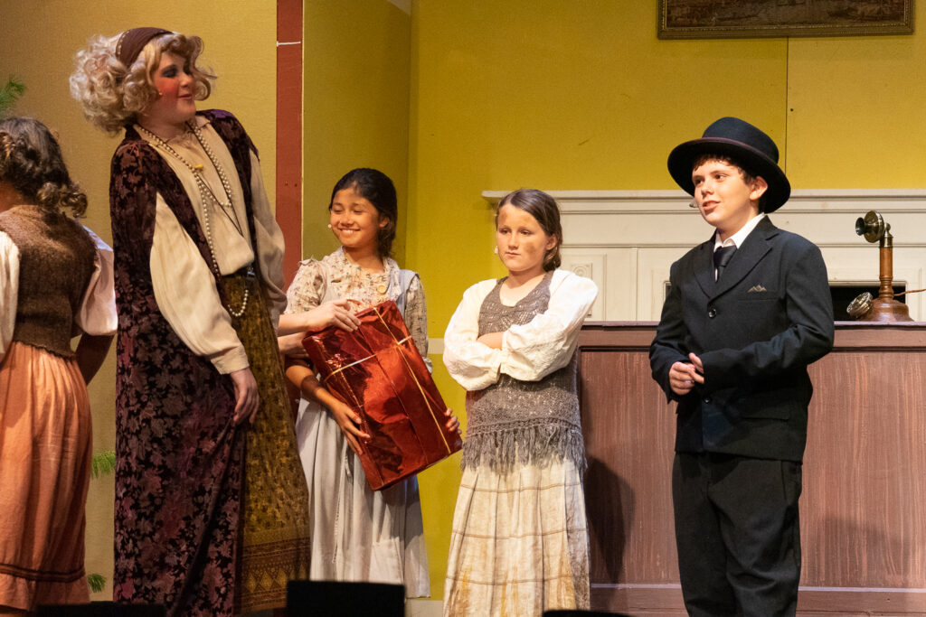 Long Lake Camp for the Arts youth performing an Annie scene
