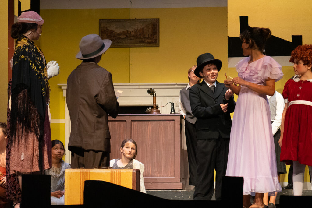 Long Lake Camp for the Arts youth performing an Annie scene