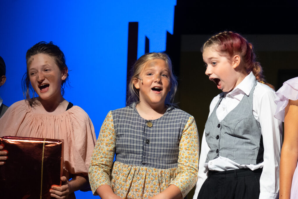 Long Lake Camp for the Arts youth performing an Annie scene