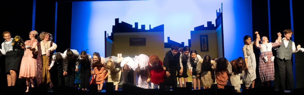 Long Lake Camp for the Arts campers acting in Annie