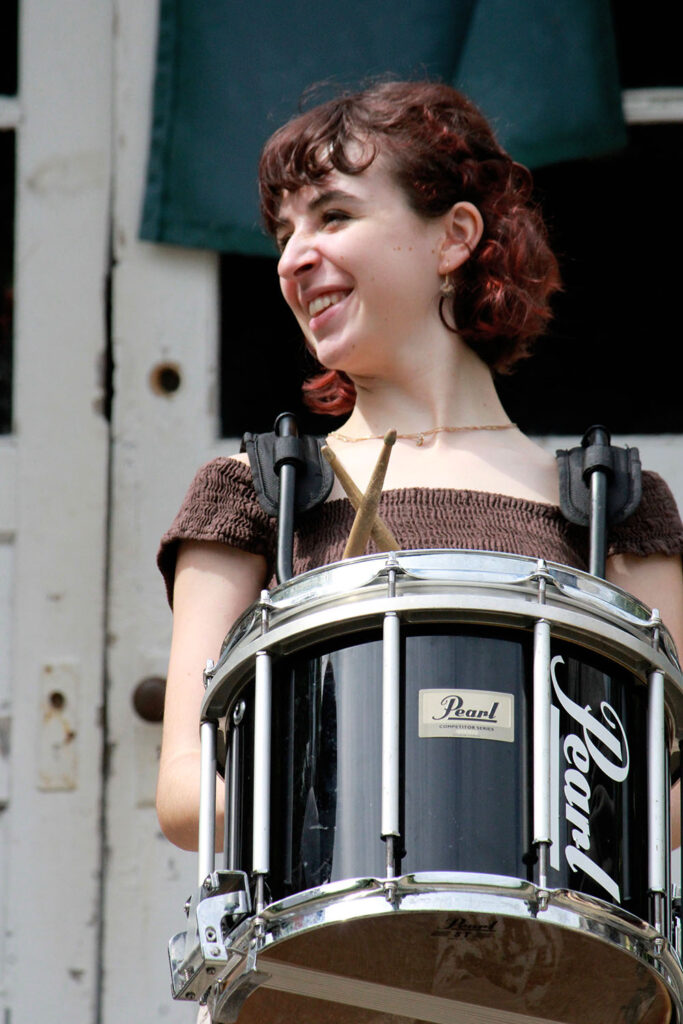 Camper playing snare drum during extravaganza rehearsal