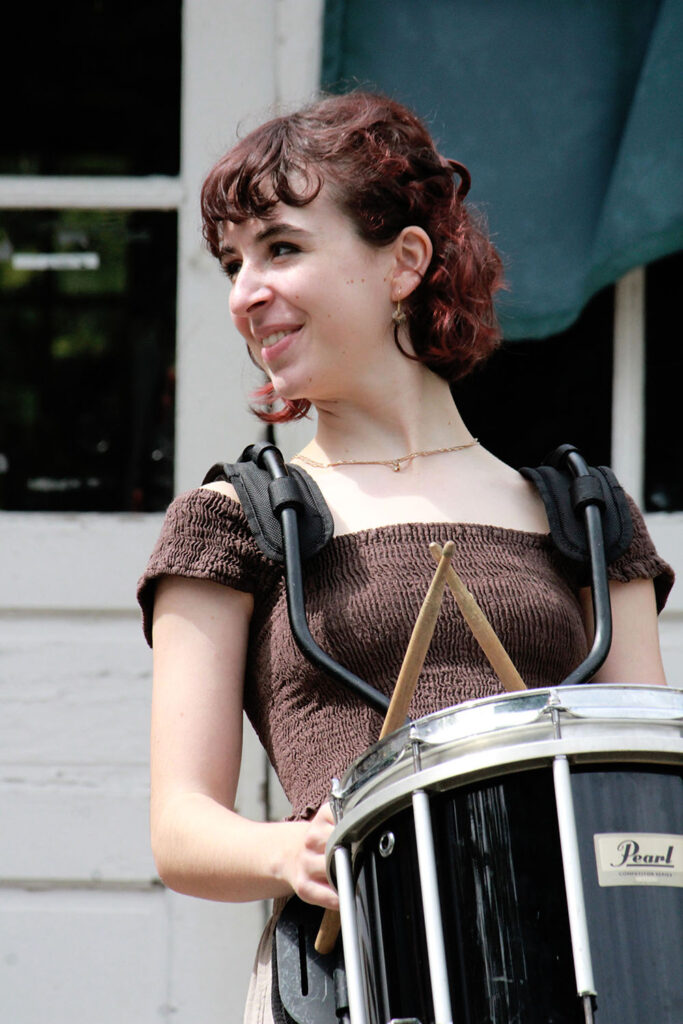 Focused drum performance practice at Long Lake Camp