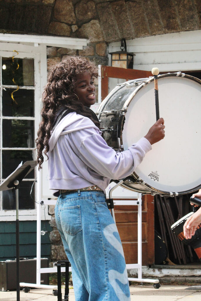 Marching percussion practice during outdoor camp music rehearsal