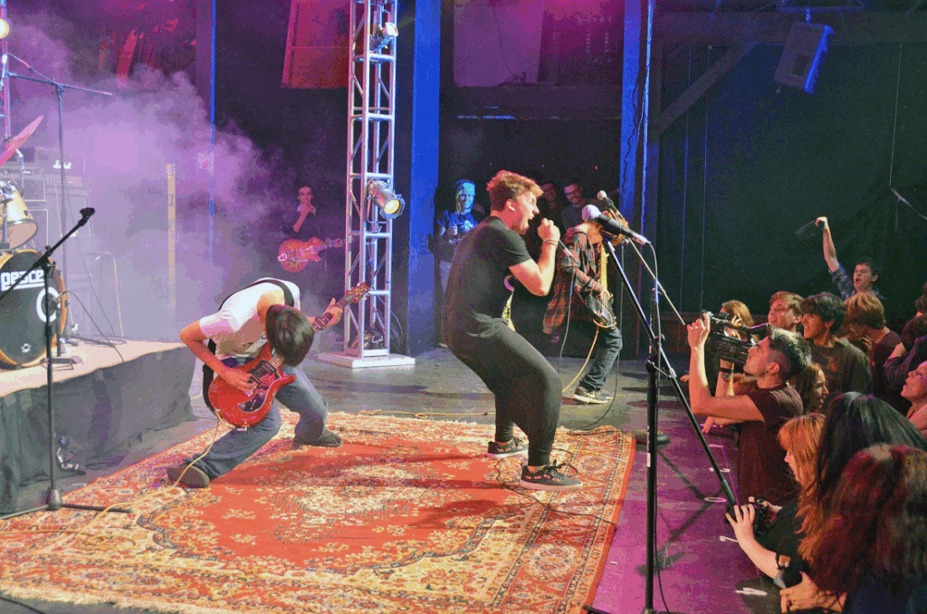 teen-boys-performing-on-stage-in-their-element – Long Lake Camp For The Arts Teen boys performing on stage with confidence and passion.