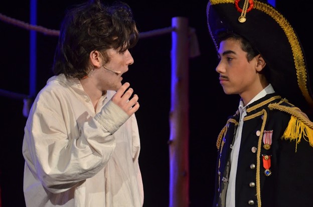 boys-in-costume-onstage – Long Lake Camp For The Arts Boys dressed in costumes, performing on stage.
