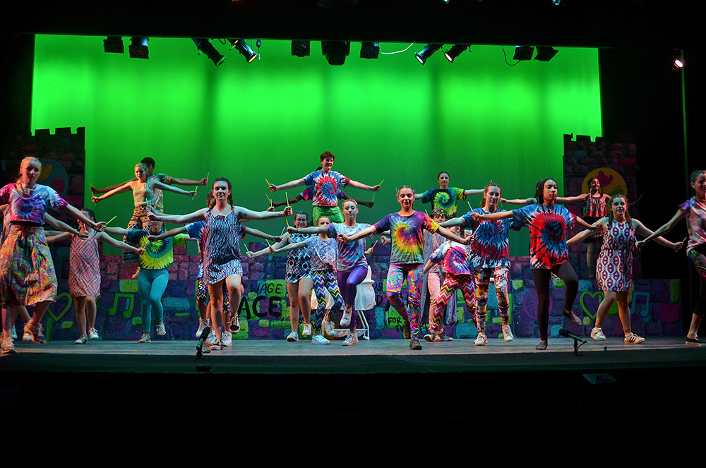 campers-dancing-sleeping-beauty-performance – Long Lake Camp For The Arts Campers performing a choreographed dance sequence from Sleeping Beauty on stage with grace and confidence
