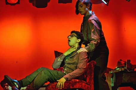 Teen boys on stage, immersed in a dramatic Sweeney Todd scene, showing emotional connection and ensemble understanding