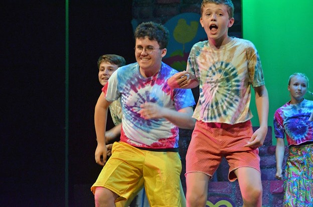 teen-boys – Long Lake Camp For The Arts Teen boys wearing colorful costumes during a theater camp production.