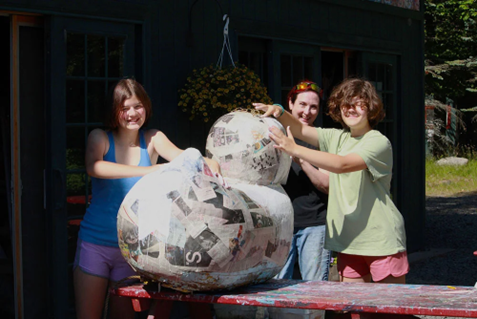 teen-sculpture-project-visual-arts-camp-2025 – Long Lake Camp For The Arts Teen campers standing proudly next to their completed sculpture alongside an encouraging art instructor at a fine arts camp