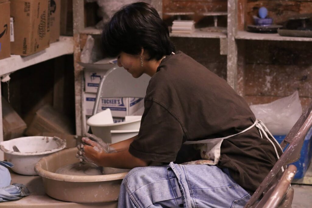 camper-ceramics-clay-moldingIMG_5784 – Long Lake Camp For The Arts Camper shaping clay during a hands-on ceramics class.