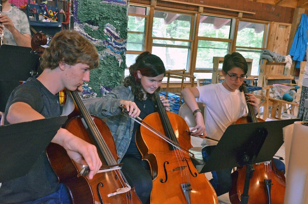 campers-playing-instruments-music-camp – Long Lake Camp For The Arts Campers playing musical instruments together during a practice session
