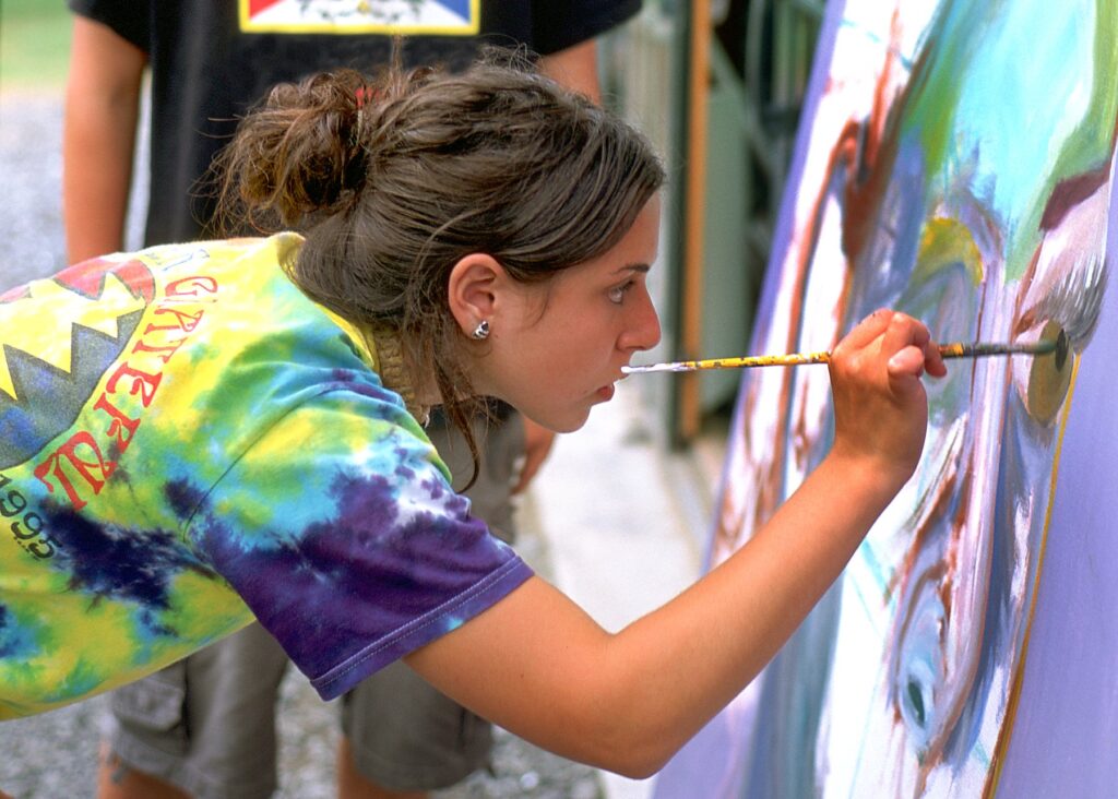 finearts – Long Lake Camp For The Arts Camper painting detailed artwork on a canvas during an art class