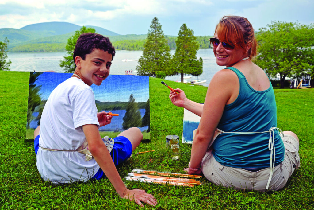 painting – Long Lake Camp For The Arts Art instructor guiding a camper during a live painting session at camp