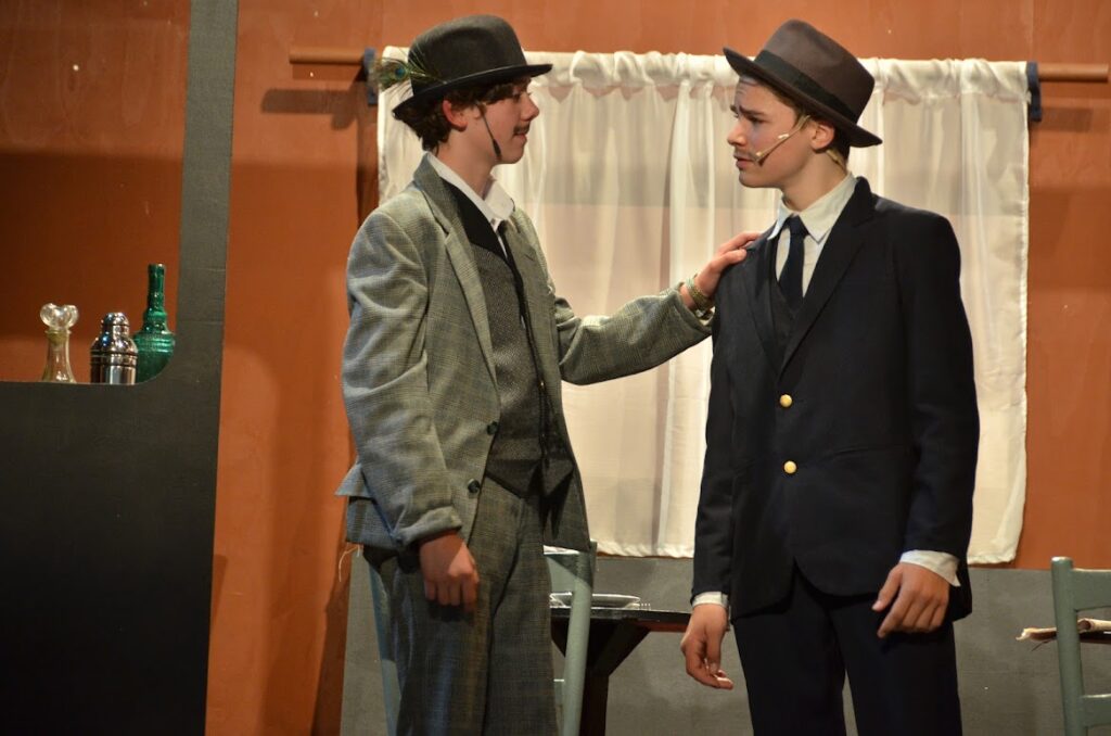 DSC_6468 – Long Lake Camp For The Arts Campers acting out Murder On The Orient Express on stage.